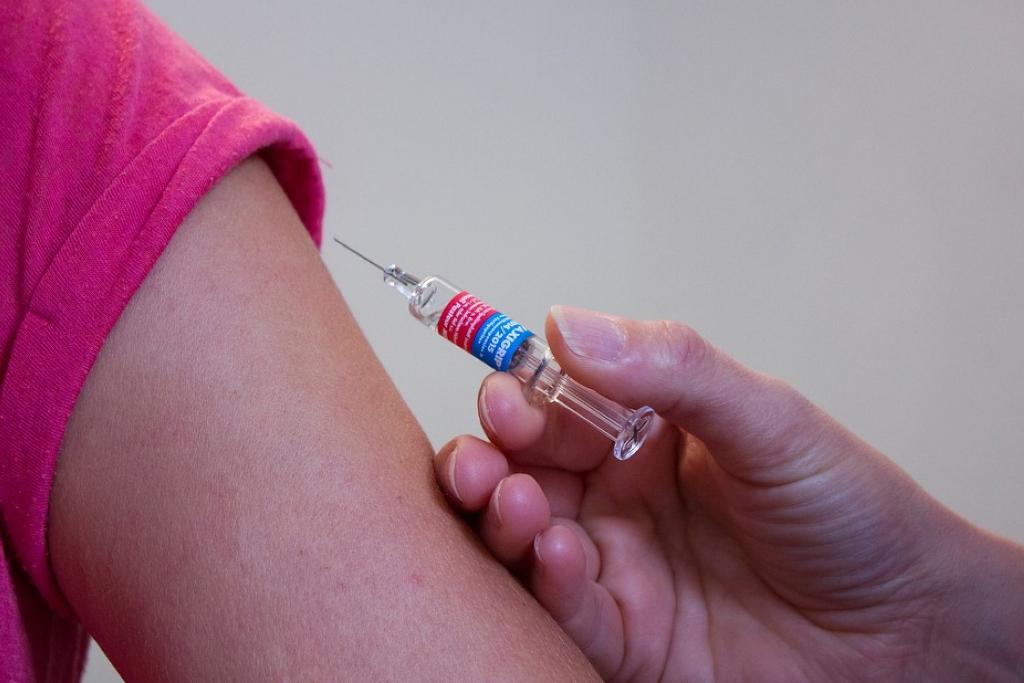 Doctor injects the vaccine for patient