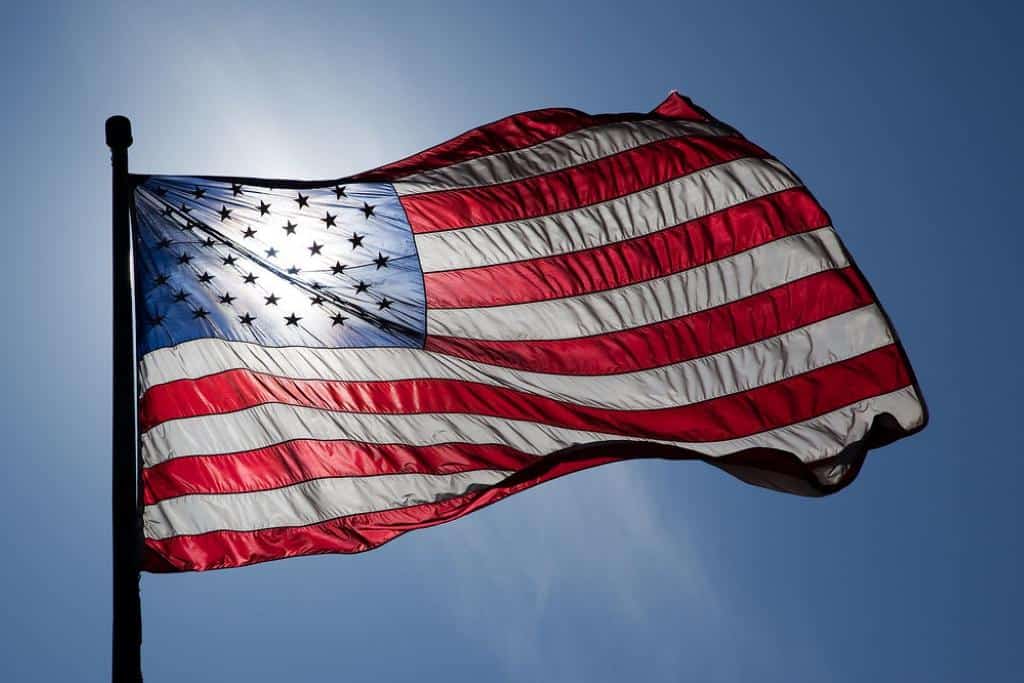 US Flag backlit by the sun