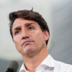 trudeau defends early election call trailing in polls