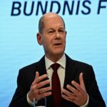 merkel era starts to end in germany as olaf scholz seals the three way deal