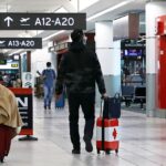 file photo: united states bound passengers walk in toronto pearson airport