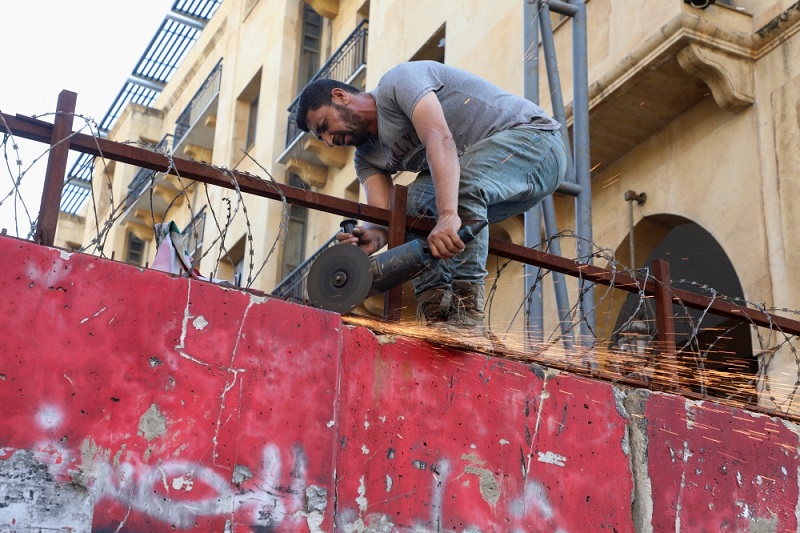 concrete barriers being removed from around lebanons parliament